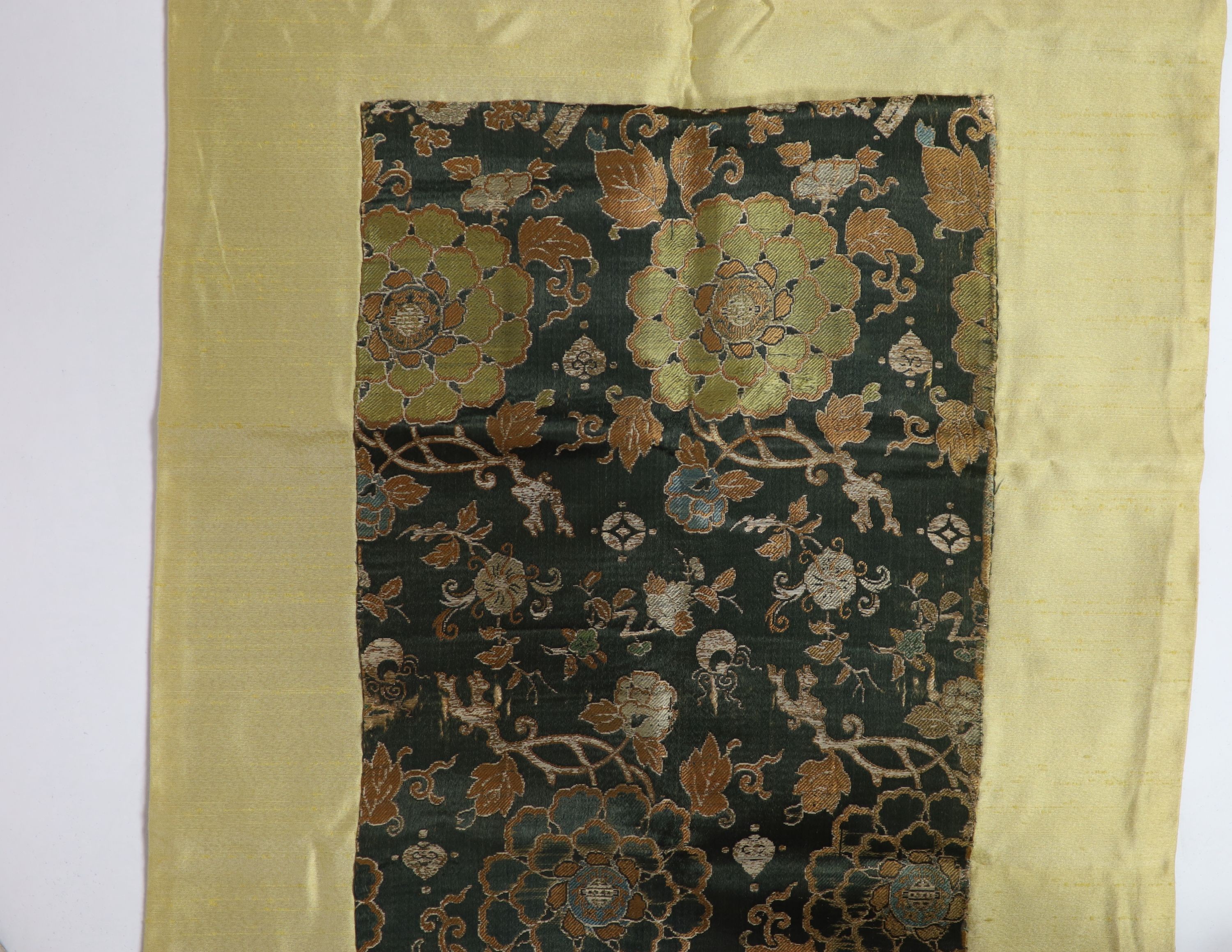 A Chinese brocade panel, 17th/18th century, Total size 169cm x 54cm